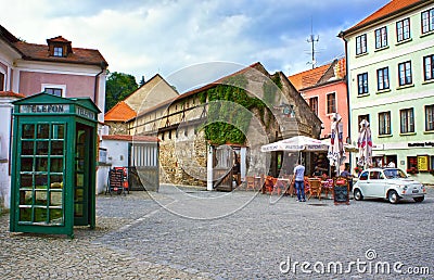 Retro wooden telephone box on the old streets of Cesky Krumlov