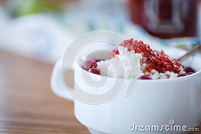 Rice porridge with jam and berries