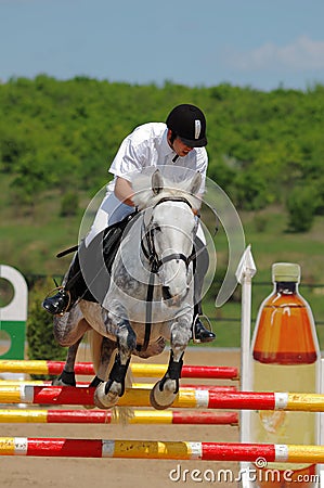 Rider in jumping show