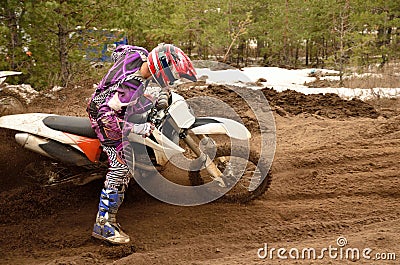 Rider stuck in deep ruts turning the sandy MX track