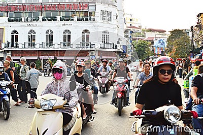 Riders ride motorbikes on busy road, Hanoi