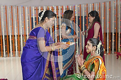 Rituals in Indian Hindu wedding showing respect and blessings.