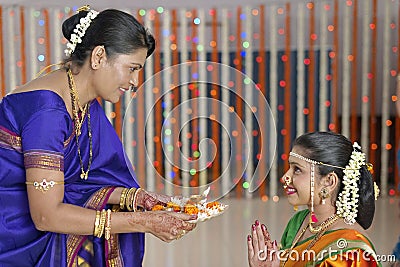 Rituals in Indian Hindu wedding showing respect and blessings.