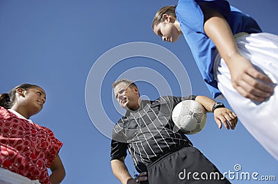 Rival Female Players In Front Of Soccer Referee