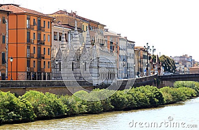 River Arno and gothic church in Pisa, Italy