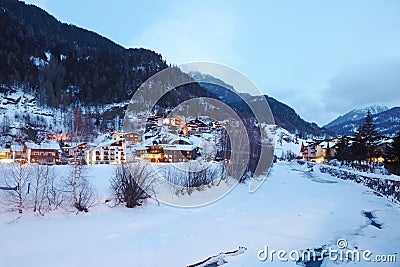 River covered by ice and small hotels