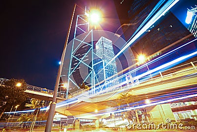 Road light trails on modern city buildings backgrounds in HongKo