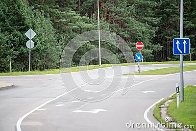 Road signs and lines on asphalt