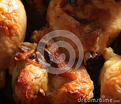 Roast chicken drumsticks on a baking pan