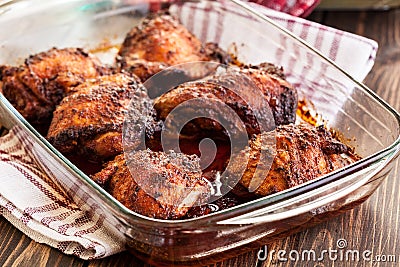 Roasted chicken drumsticks in casserole dish