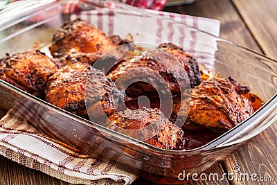 Roasted chicken drumsticks in casserole dish