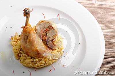 Roasted chicken legs with cooked Saffron rice