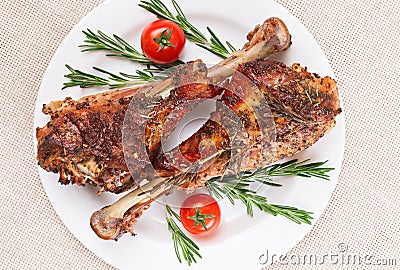 Roasted turkey legs on white plate