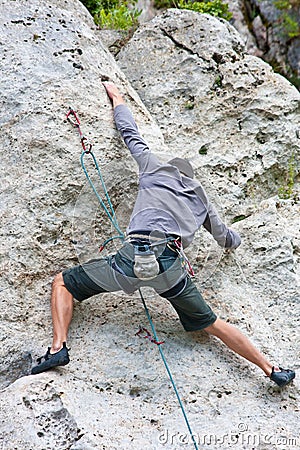 Rock climber - athletic man