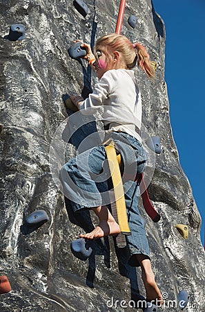 Rock climbing girl with face painting