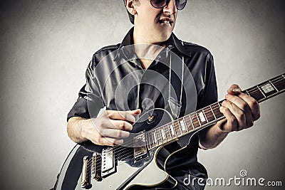 Rock man playing the guitar