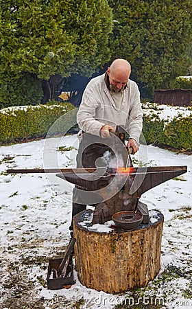Blacksmith Working Outside in Winter