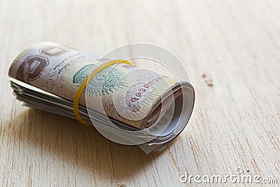 A roll of Thai money.