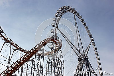 Roller coaster track and ferris wheel