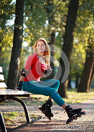 Roller sporty girl in park, woman outdoor fitness