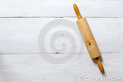 Rolling pin on a rustic light wood background