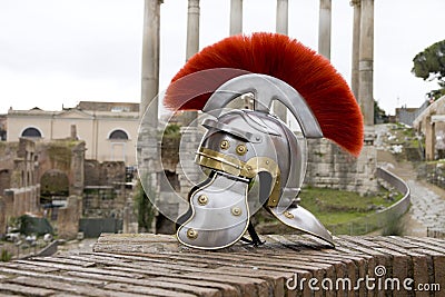 Roman soldier helmet in front of ancient roman ruins.