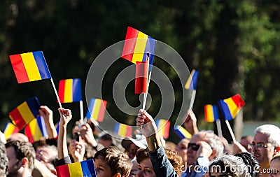 Romanian crowd waving flags