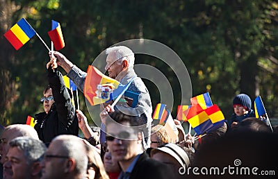 Romanian crowd waving flags