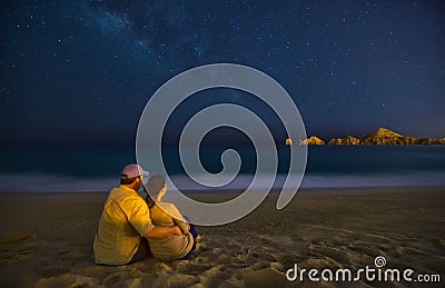 Romantic Couple On Beach At Night in Cabo San Lucas Mexico