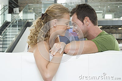 Romantic Couple On Sofa In Living Room