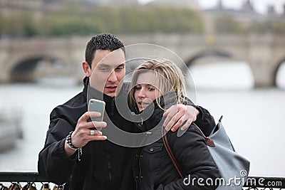 Romantic couple take a pic in Paris