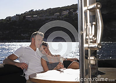 http://thumbs.dreamstime.com/x/romantic-couple-yacht-having-champagne-sitting-table-33891555.jpg