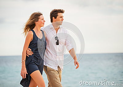 http://thumbs.dreamstime.com/x/romantic-happy-couple-walking-beach-sunset-smiling-arms-around-each-other-man-women-love-35120049.jpg