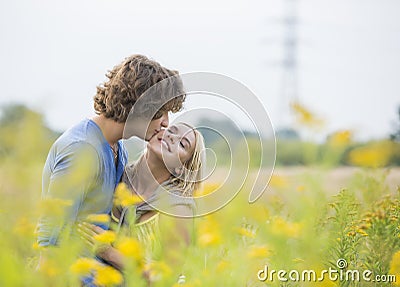 http://thumbs.dreamstime.com/x/romantic-man-kissing-woman-field-men-women-41409026.jpg