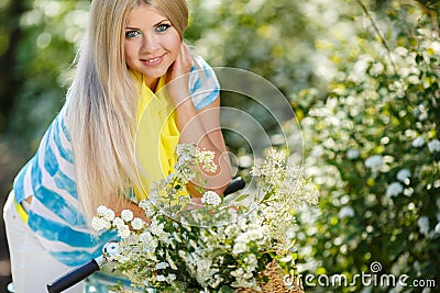 Romantic portrait of a girl with a bicycle