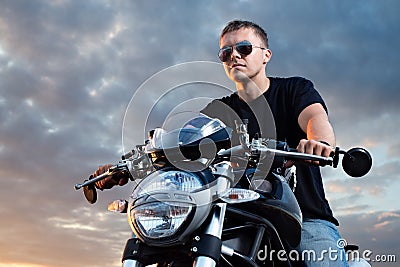 Romantic portrait handsome biker man in sunglasses