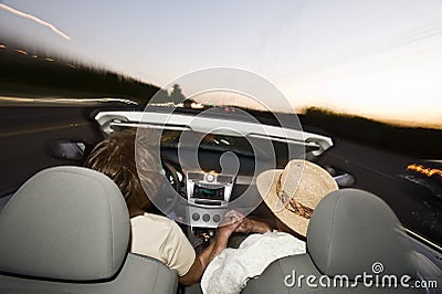 Romantic Senior Couple Driving Convertible Car