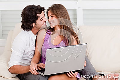 Romantic young couple with laptop