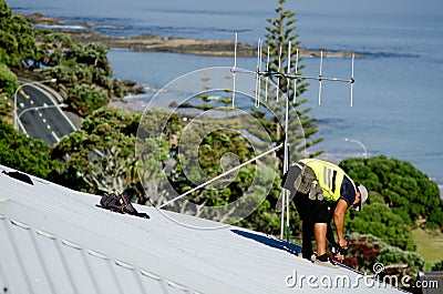 Roofer fixing a leaking roof