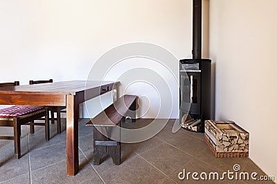 Royalty Free Stock Images: Room with table and wood stove