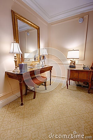 Room with vanity table and mirror