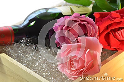 Rose flowers and wine bottle