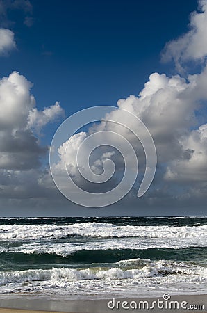 Rough sea blue sky and white clouds
