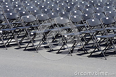 Row of black empty chairs