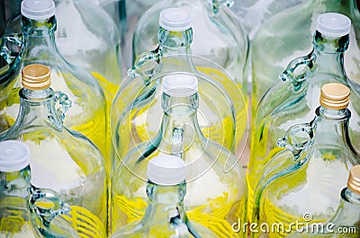 Row of empty big glass bottles