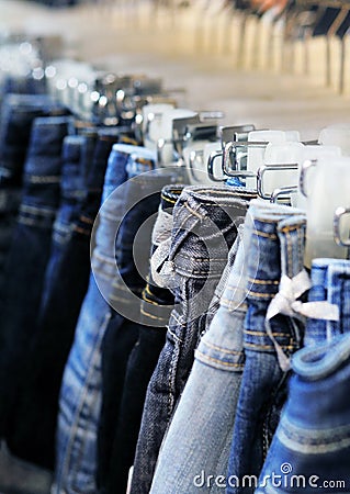 Row of hanged blue and black jeans