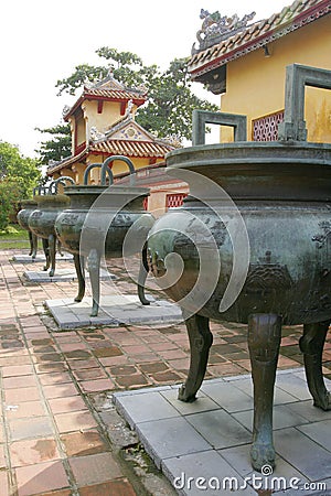 Row of large copper urns