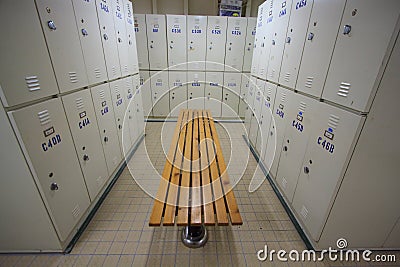 Row of steel lockers along the chair, Locker room for worker in job site, Keep personal belonging in sport complex.