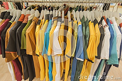 Row of tshirts hanging on a rail