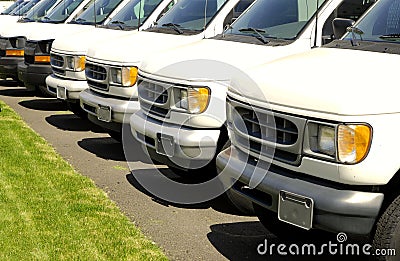 Row of white cars on a lot